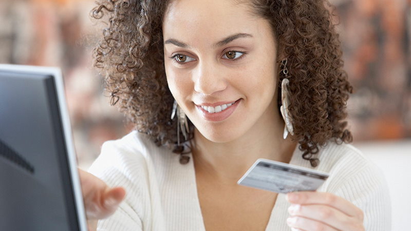 Woman paying online with card